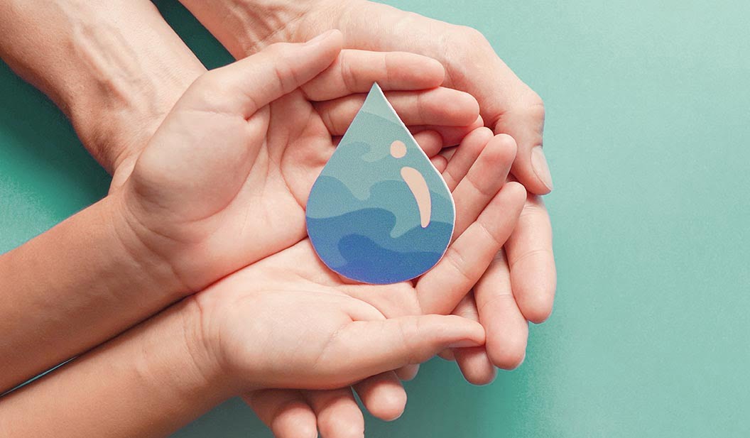 Adult and child hands holding water drop, World Water Day,  Clea Adult and child hands holding paper cut water drop, World Water Day,  Clean water and sanitation, CSR, save water,  ecology concept